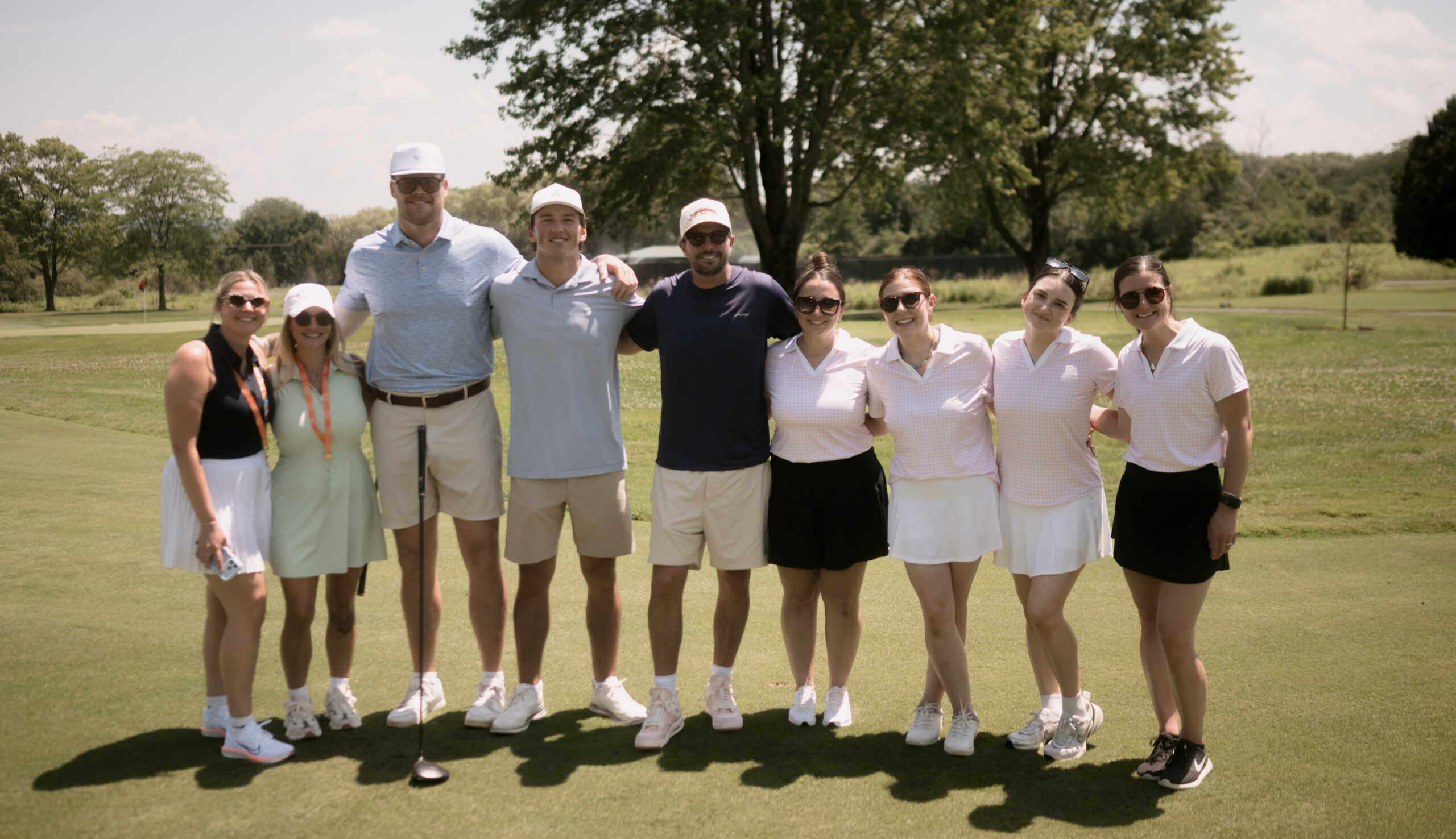 Terakeet employees and Buffalo Bills players smile at the Terakeet Invitational
